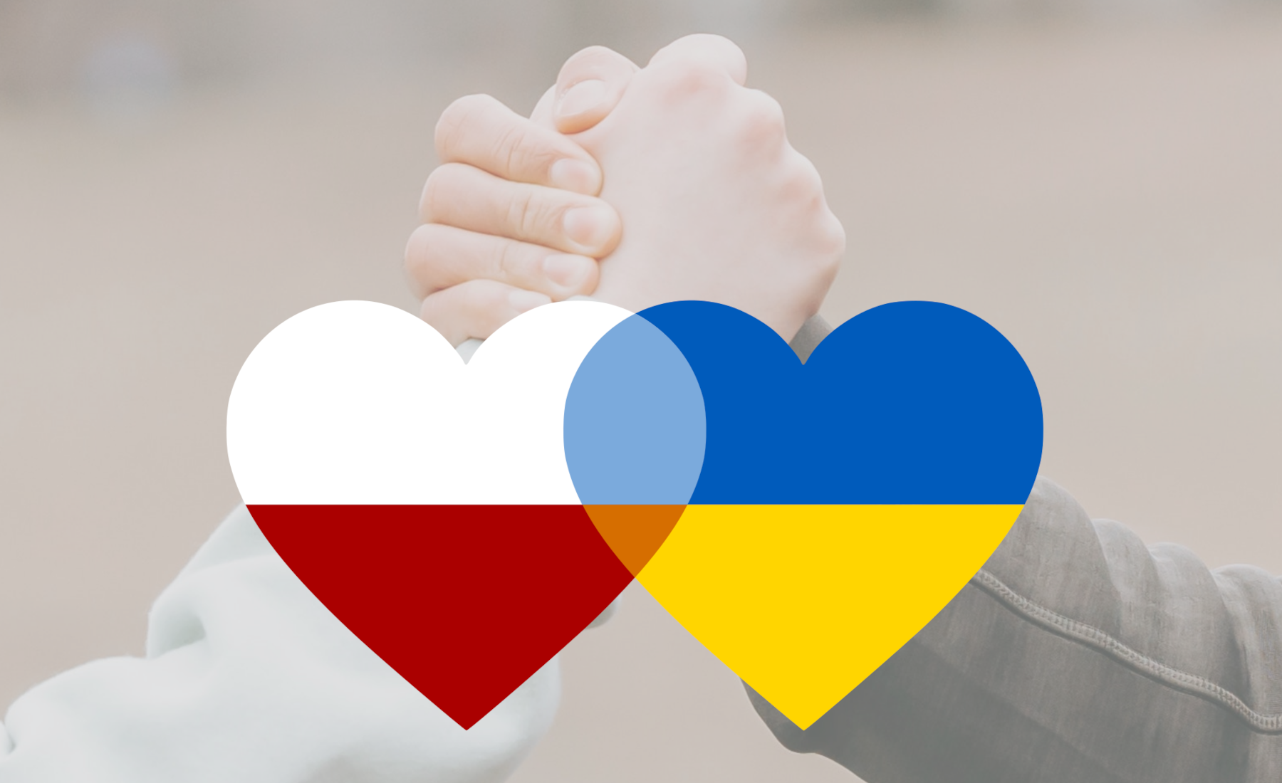 Zaciśnięte dłonie i serca w barwach polskich i ukraińskich